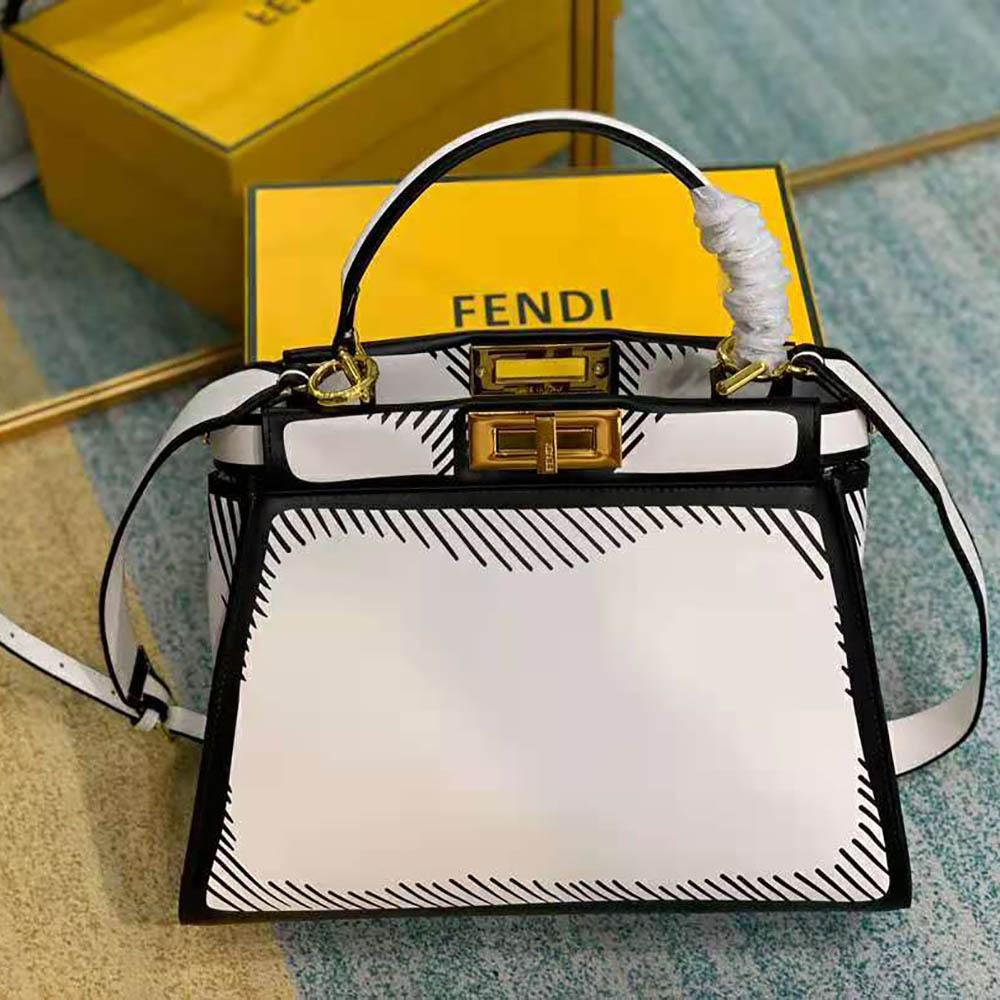 Close-up of gold-tone hardware on Fendi Women Peekaboo Iconic White Bag