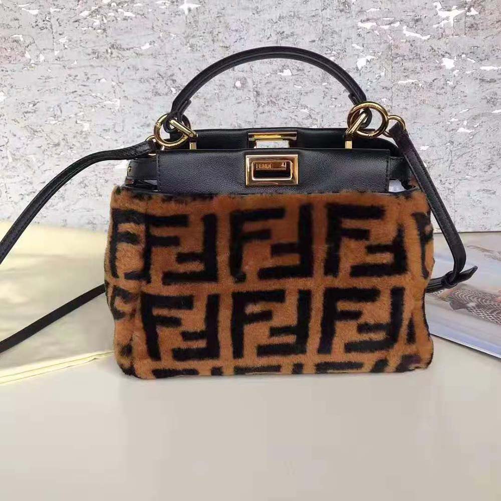 Close-up of gold hardware on Fendi Women Peekaboo Iconic Mini Brown Sheepskin Bag
