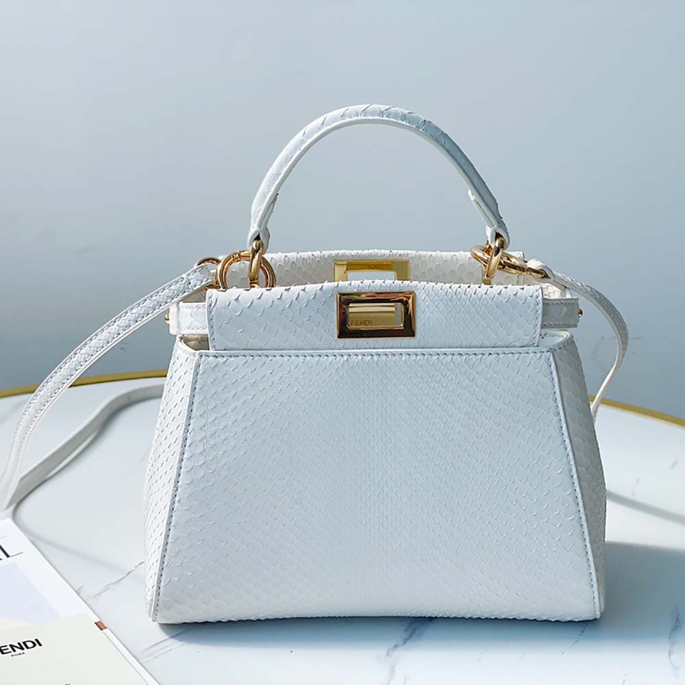 Close-up detail of python texture and gold hardware on Fendi bag