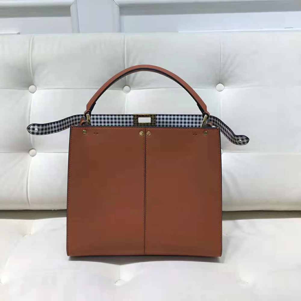 Side angle showing silhouette and leather of Fendi Women Peekaboo X-Lite bag