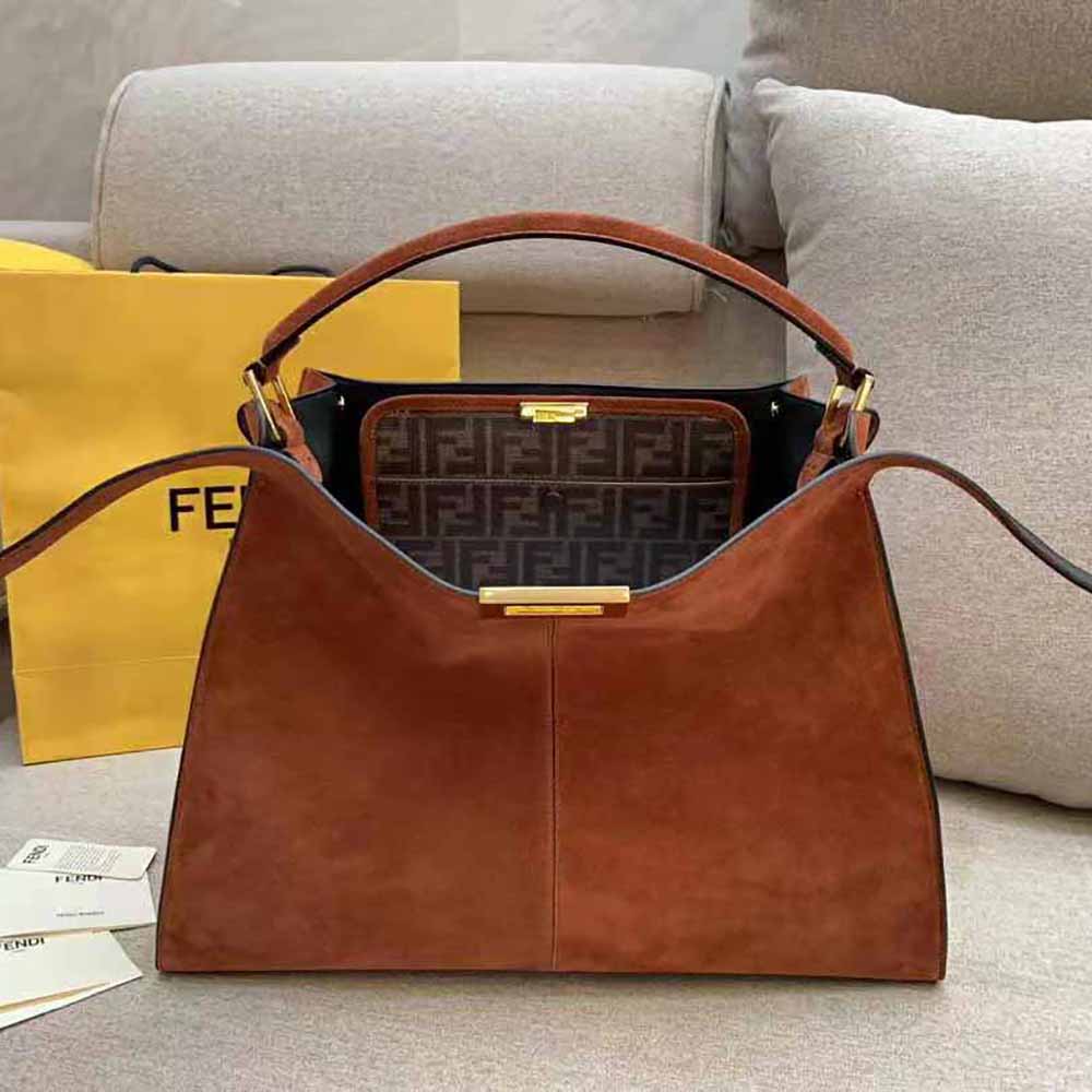 Close-up of gold hardware and brown suede on Fendi Women Peekaboo X-Lite Bag