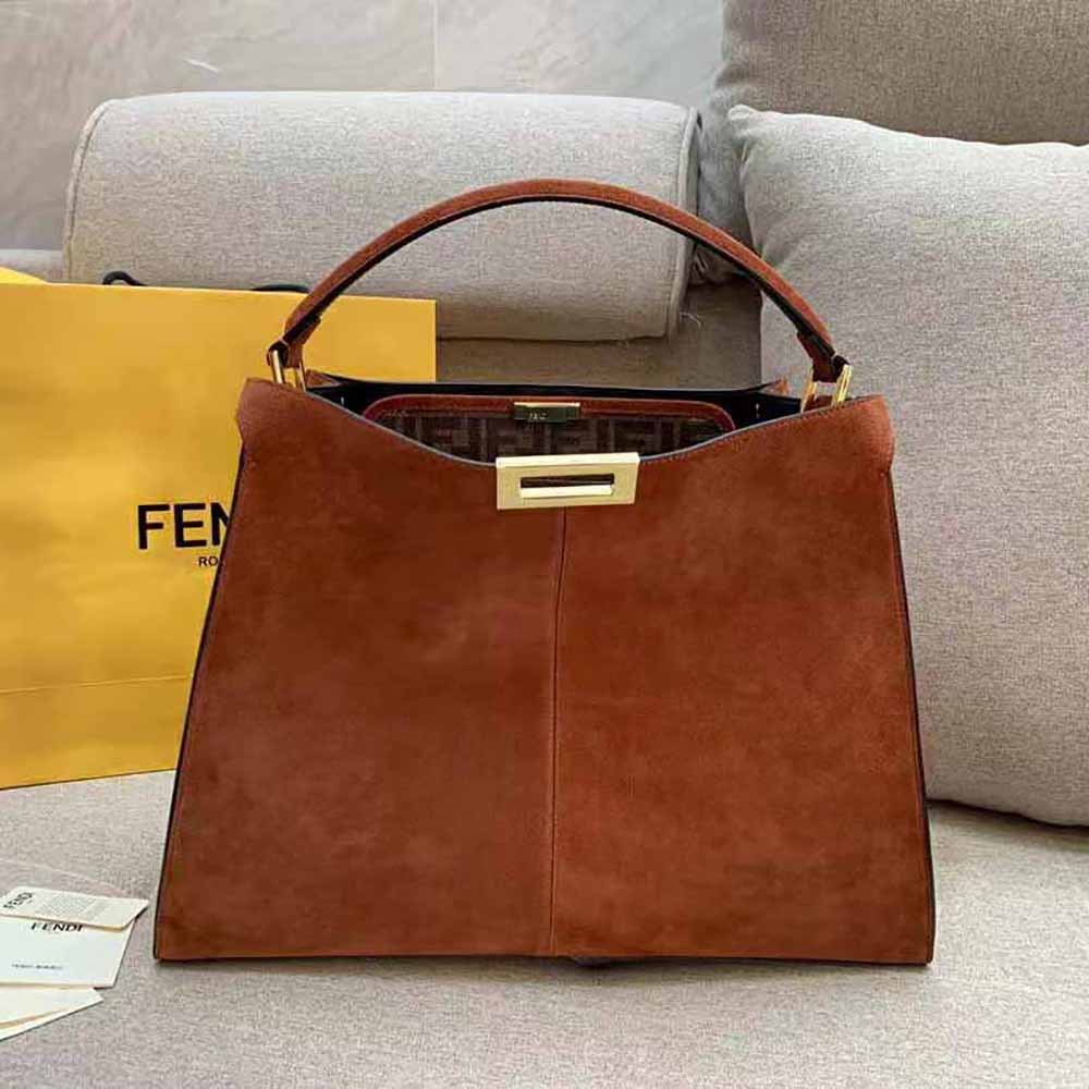 Side angle highlighting shape of Fendi Women Peekaboo X-Lite Medium Brown Suede Bag