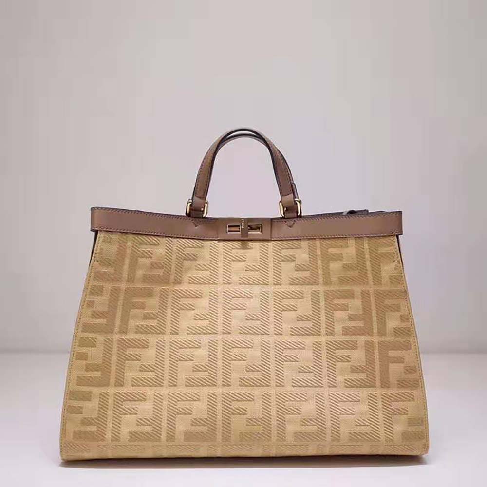 Close-up of gold-tone hardware and leather trim on Fendi Peekaboo X-Tote