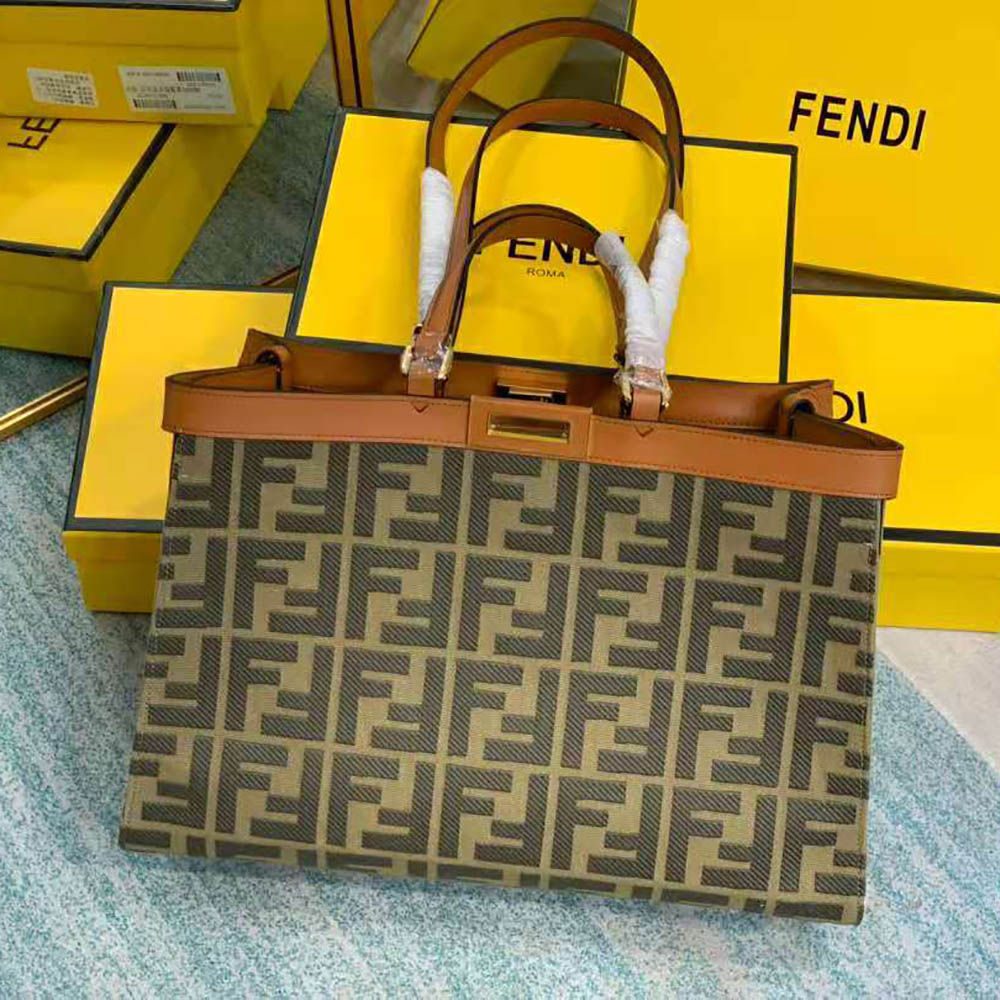 Close-up of Fendi Women Peekaboo X-Tote leather trim and gold hardware