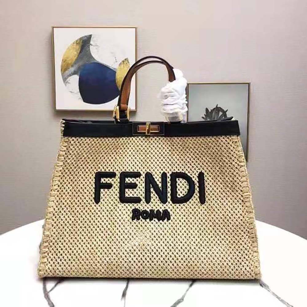 Close-up of brown leather trim and gold hardware on Fendi bag