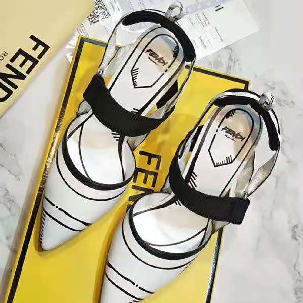 Close-up on gold-tone Fendi logo hardware on slingback strap