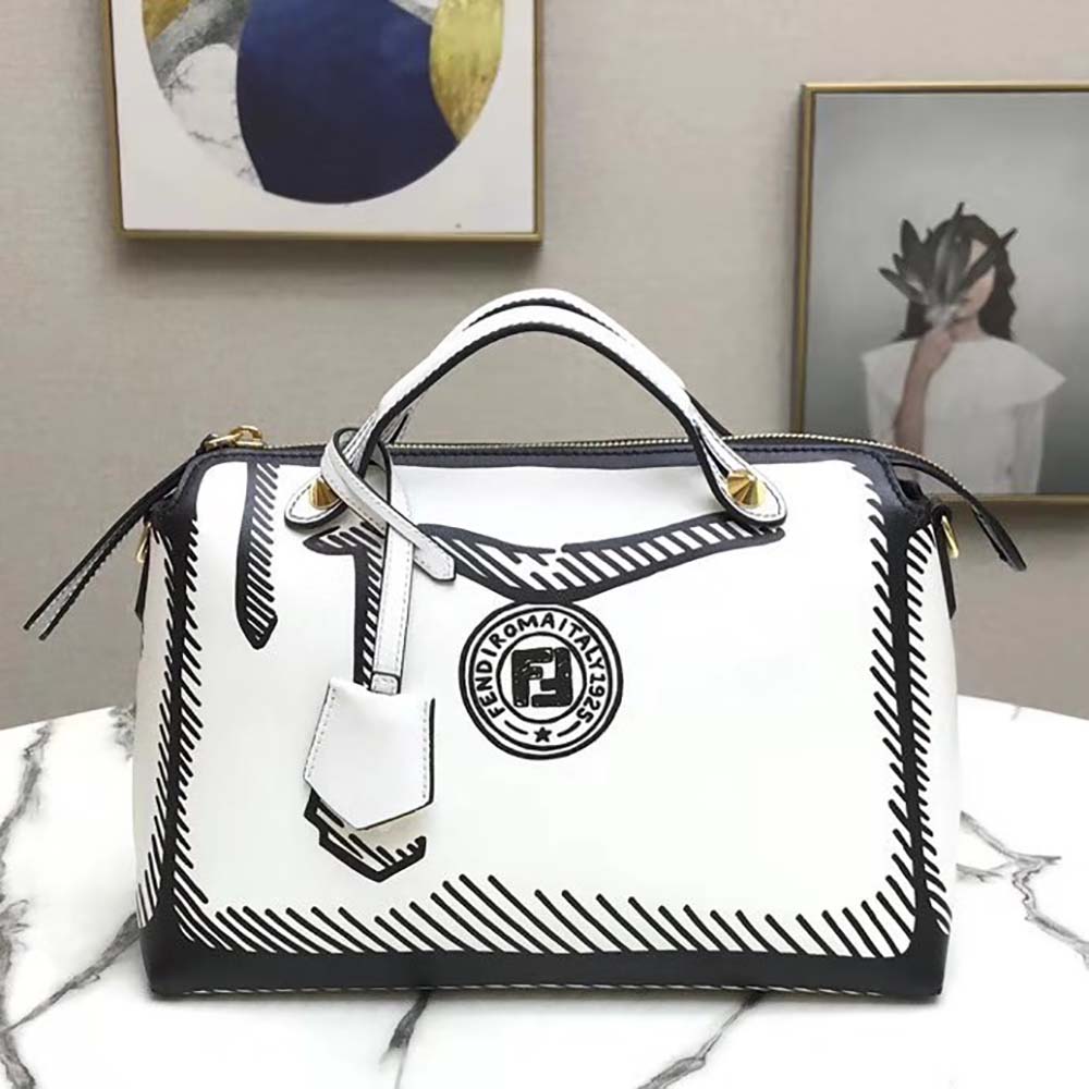 Close-up showing printed Fendi logo on white leather bag