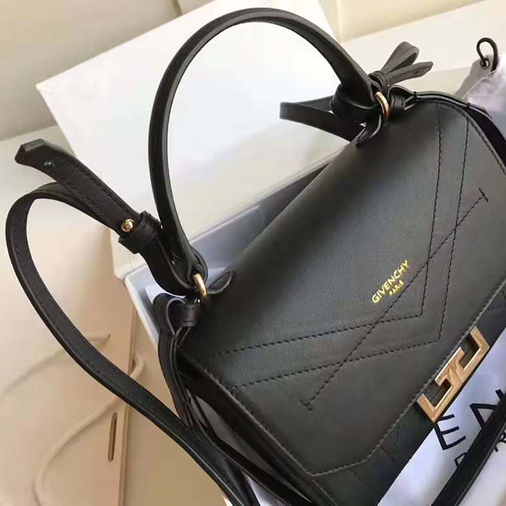 Side angle showing silhouette and flap closure of Givenchy Mini Eden Bag
