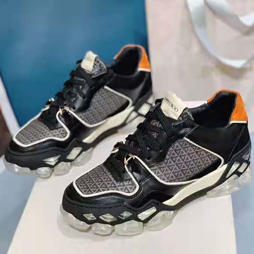 Close-up of crystal embellishments on Jimmy Choo Diamond X Trainers in black