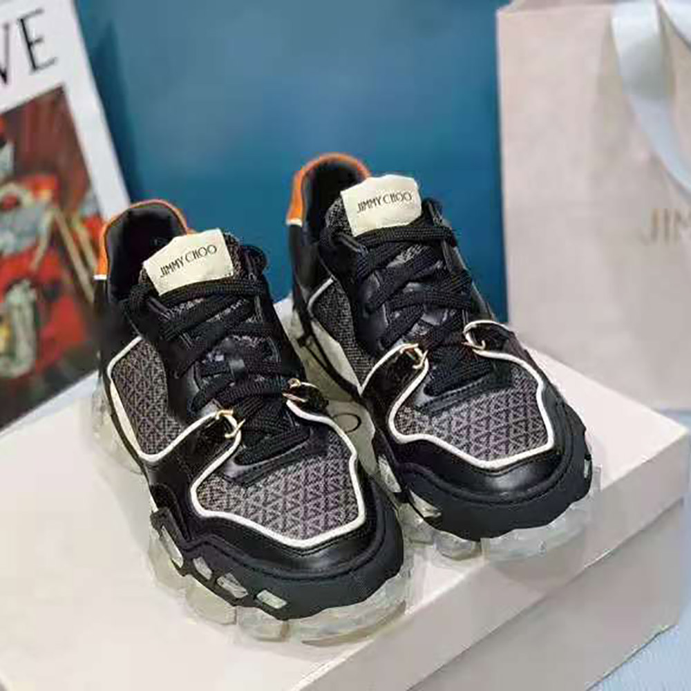 Top-down angle showing lace-up closure on Jimmy Choo low-top black trainers