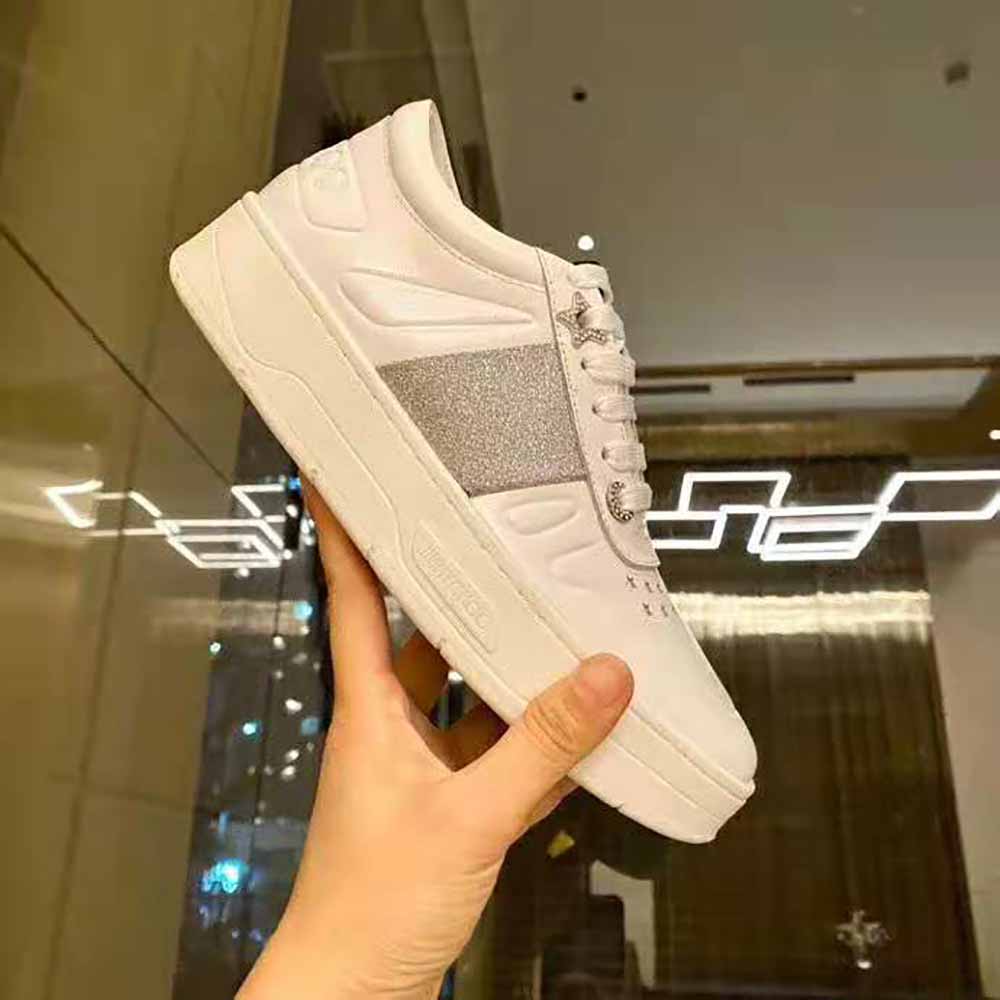 Close-up detail of glitter stripe on Jimmy Choo Hawaii F white calf leather trainers