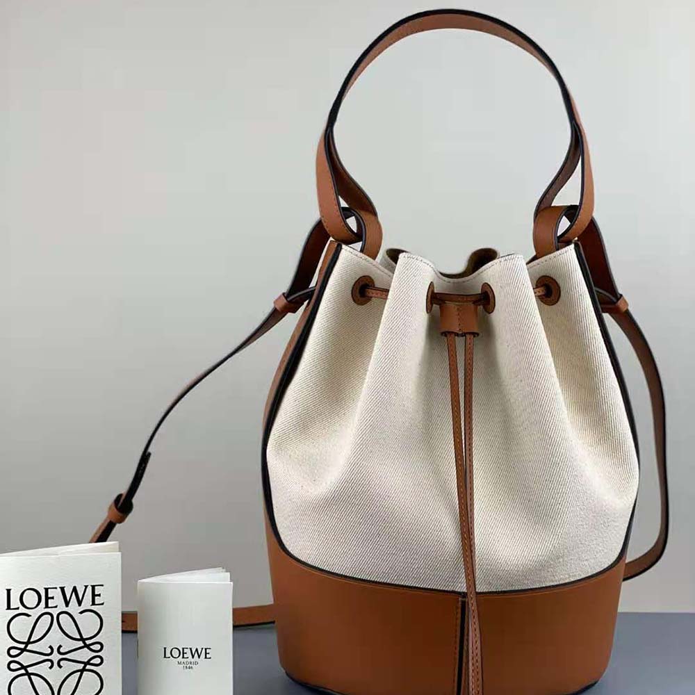 Close-up of leather trim and gold hardware on Loewe Women Balloon Bag