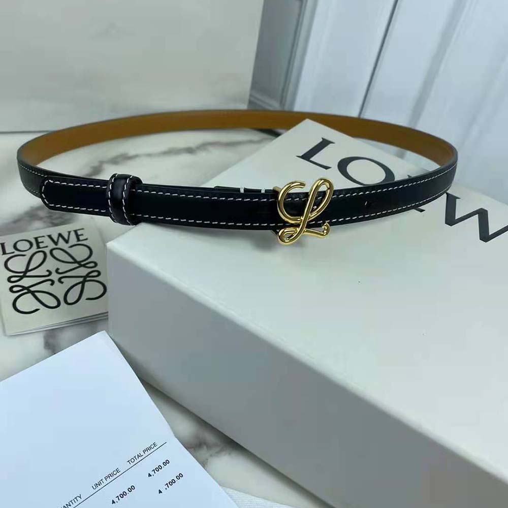 Close-up of embossed Loewe logo on black calfskin belt