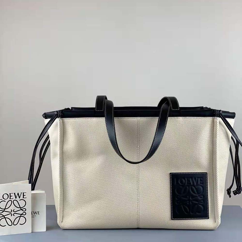 Close-up on silver hardware and embossed Loewe logo on Cushion Tote Bag
