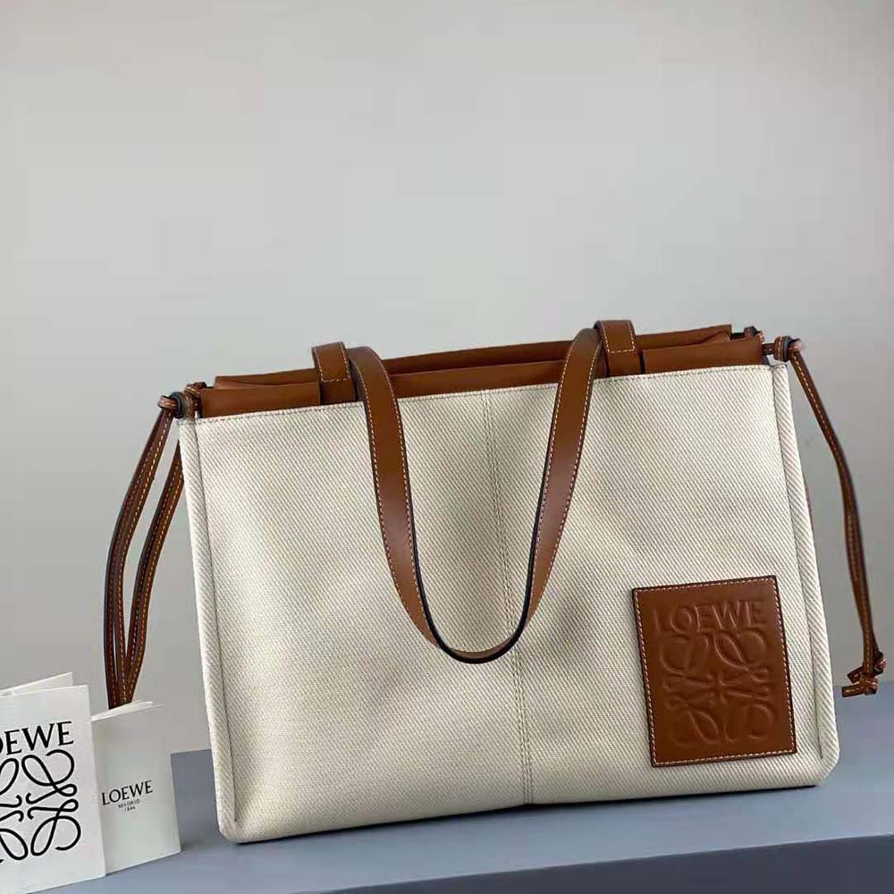 Close-up of Loewe embossed detail on Cushion Tote Bag in Brown
