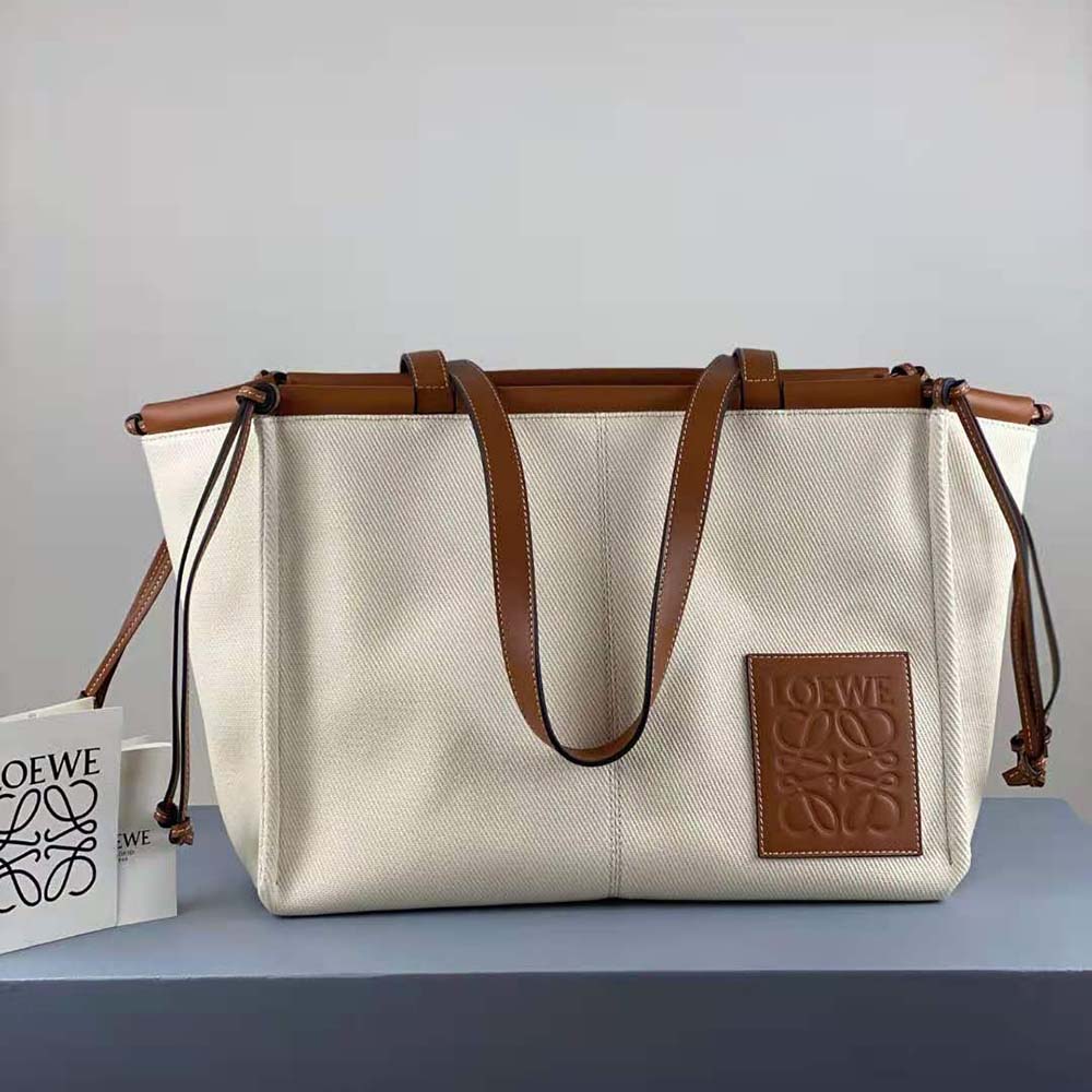 Side view showcasing gold-tone hardware on Loewe Cushion Tote Bag
