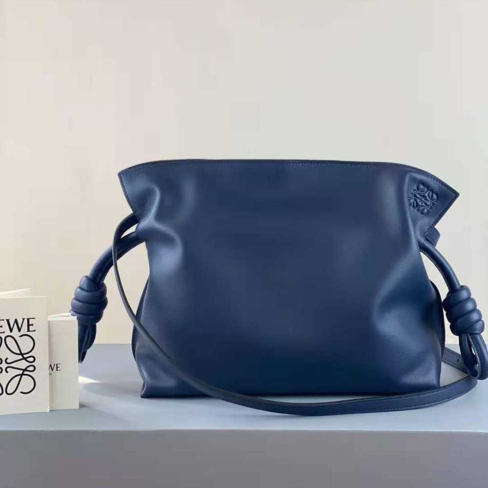 Close-up detail of blue leather and metal hardware on Loewe Flamenco Clutch