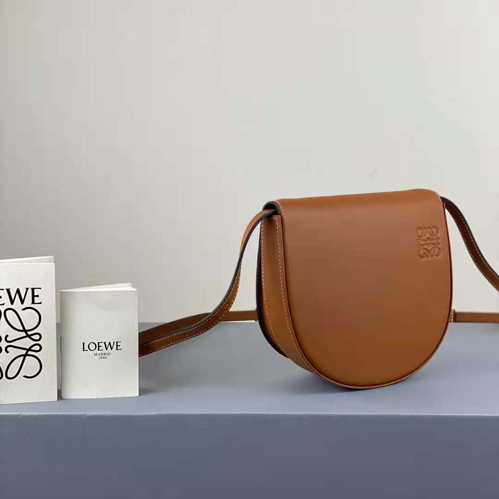 Side angle showing sculptural silhouette of Loewe Women Heel Bag