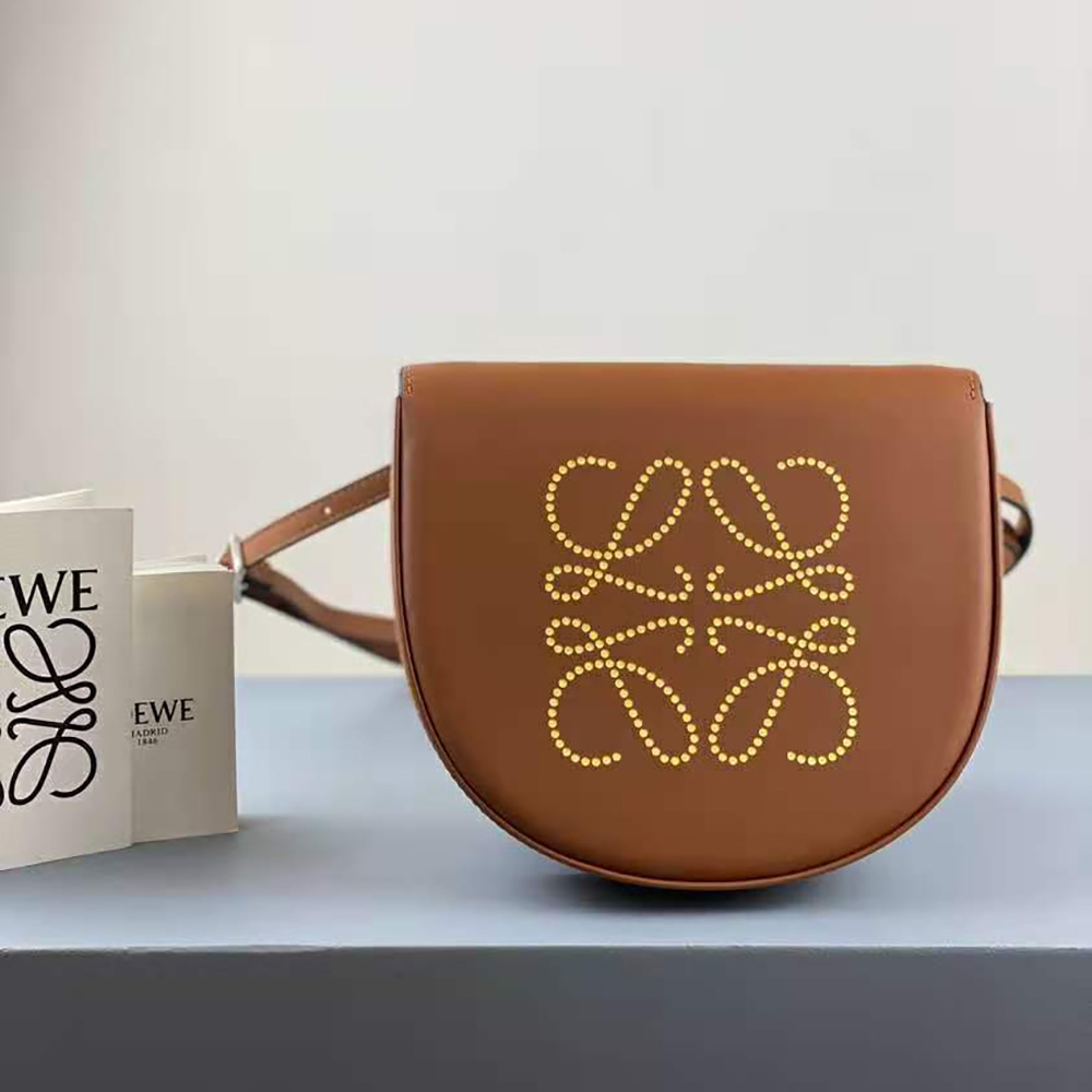 Close-up of gold-tone hardware and Loewe logo on Heel Bag leather