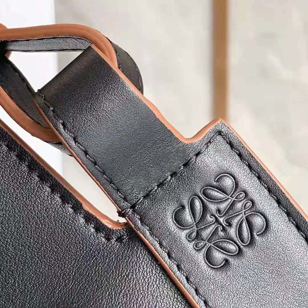 Side profile showing structured silhouette of Loewe Women Horseshoe Bag