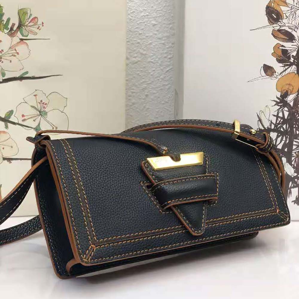 Side angle showing adjustable strap and silver hardware on Loewe Mini Barcelona bag