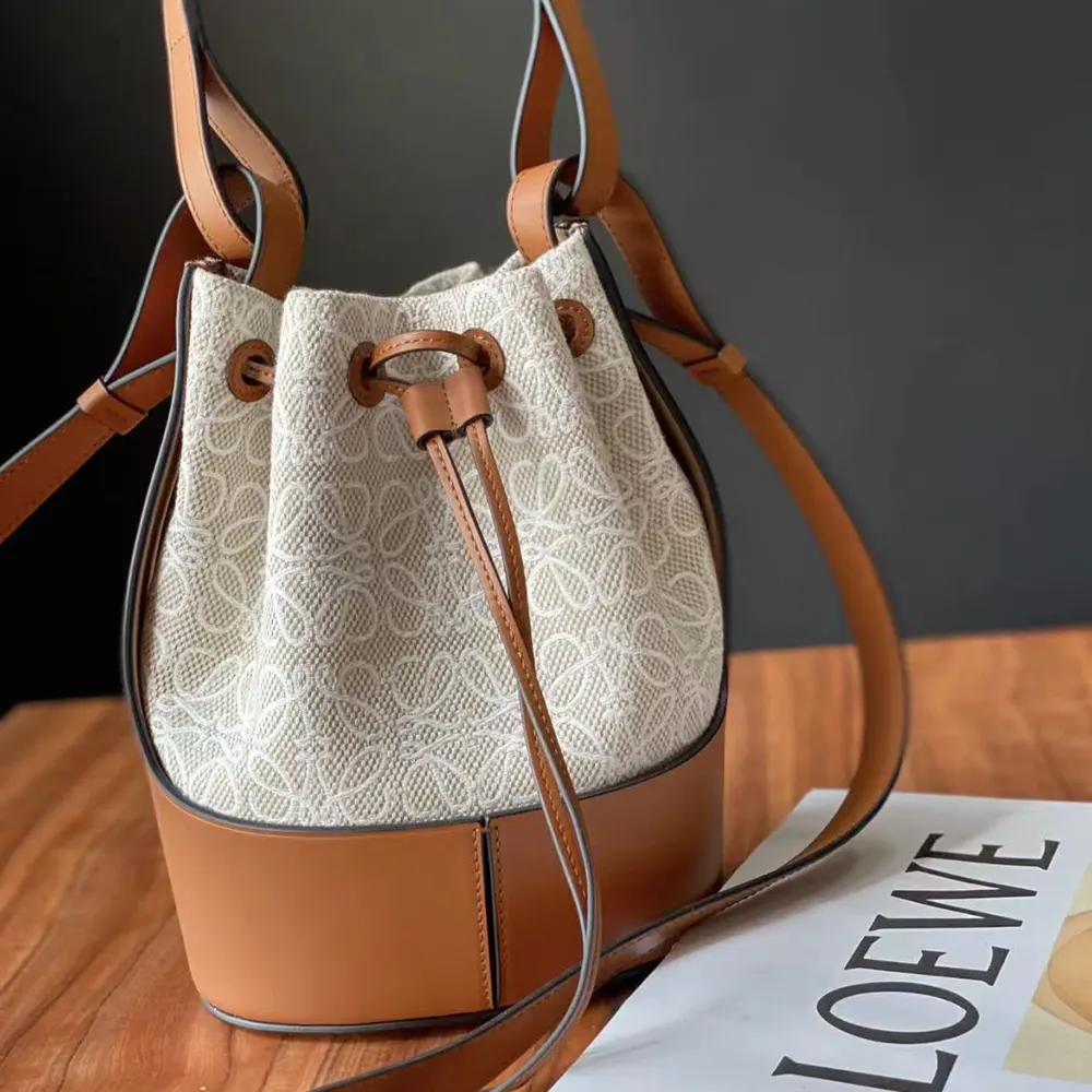 Side view showcasing the compact silhouette of Loewe Women Small Balloon Bag