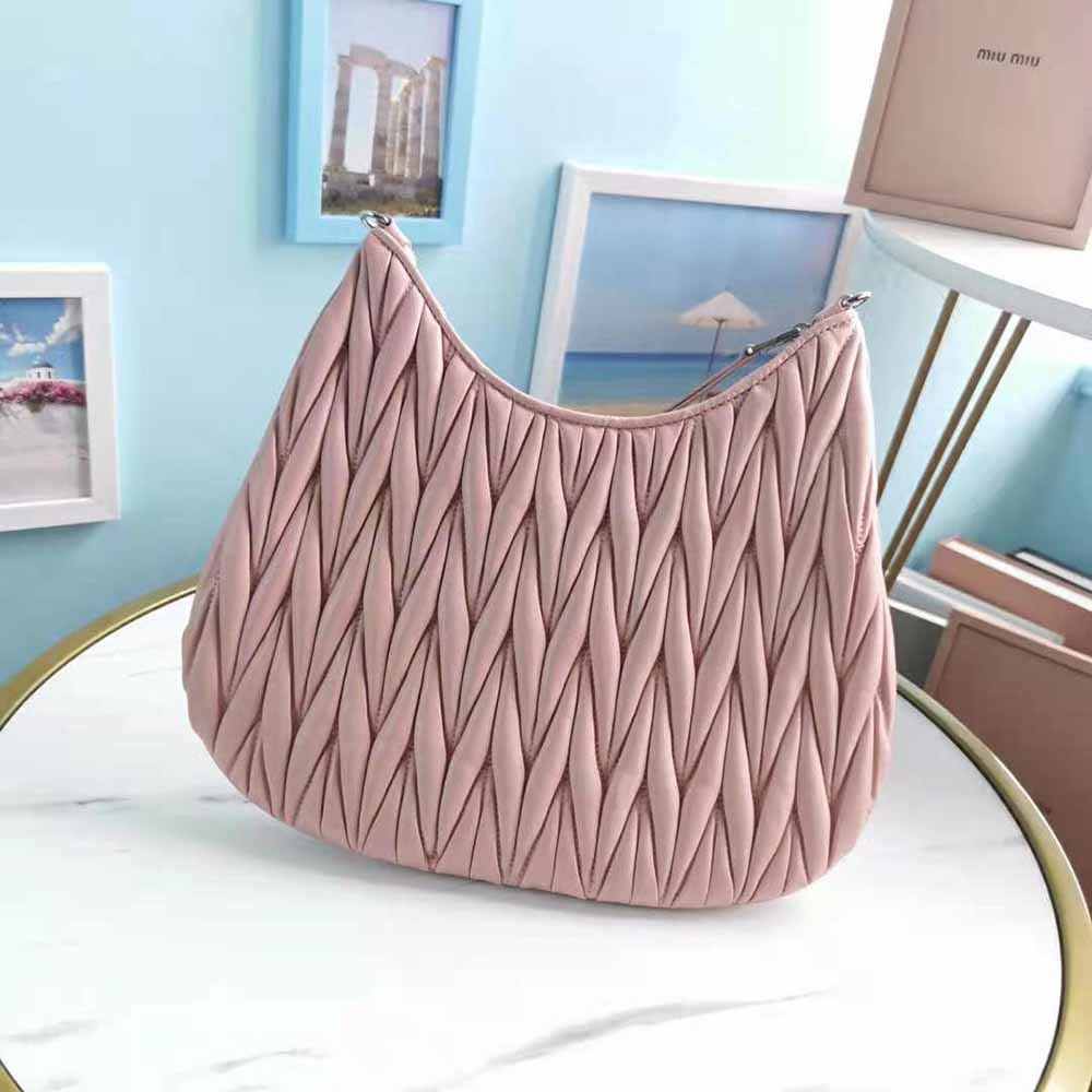 Side view showing spacious interior of Miu Miu Women Large Matelasse Nappa Leather Shoulder Bag-Pink