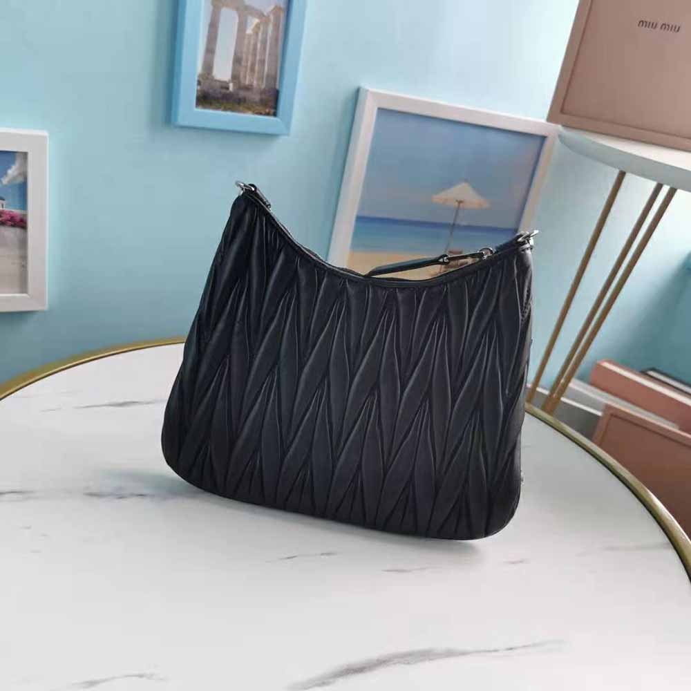Side angle showing structured silhouette of Miu Miu Women Small Matelassé Nappa Leather Shoulder Bag-Black