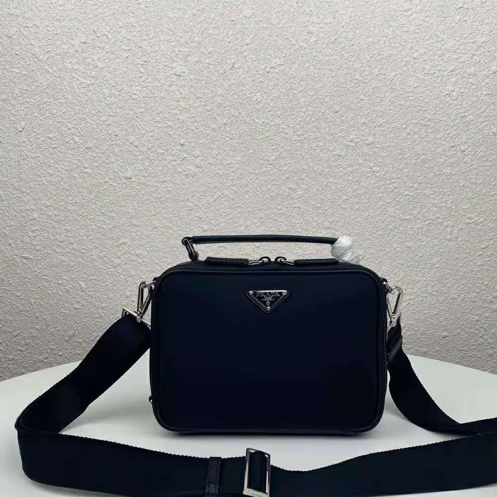 Close-up of textured saffiano leather on Prada Men Brique bag in black