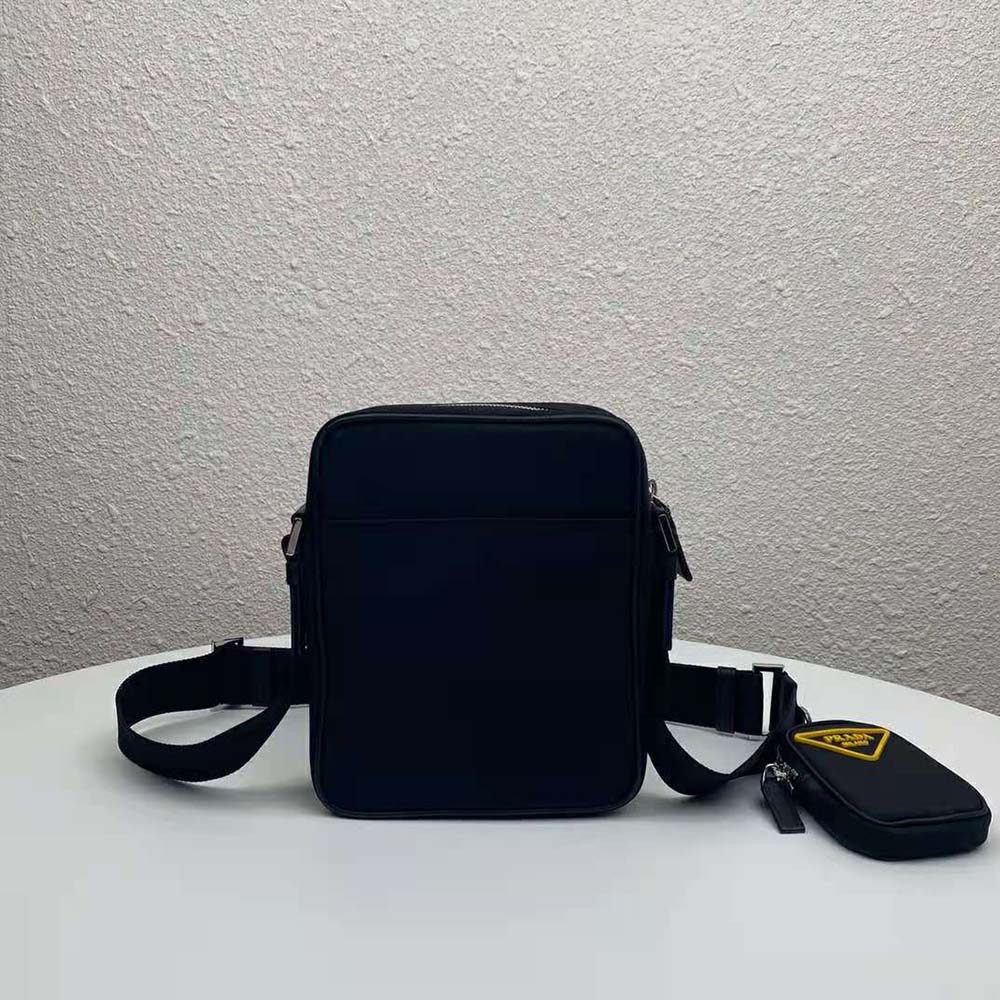Close-up of zip closure and vibrant yellow panel on Prada cross-body bag