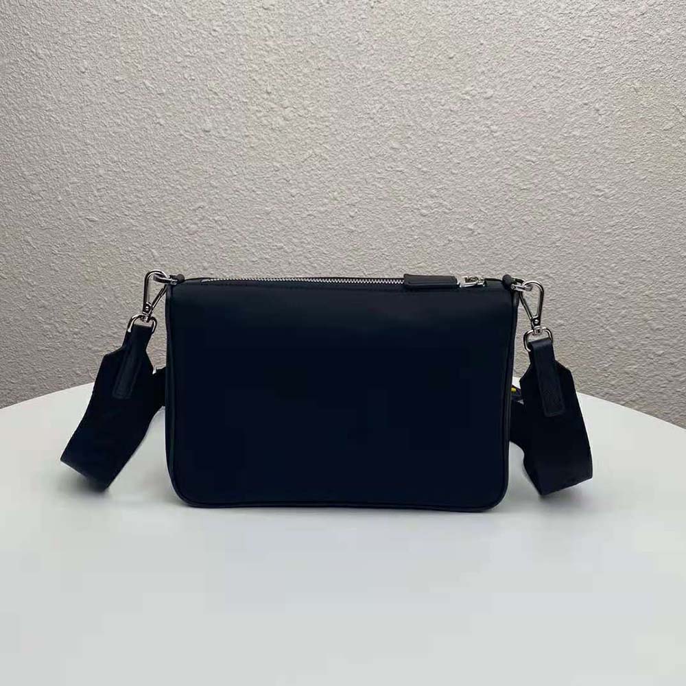 Side angle showing adjustable strap and sleek nylon texture of Prada bag