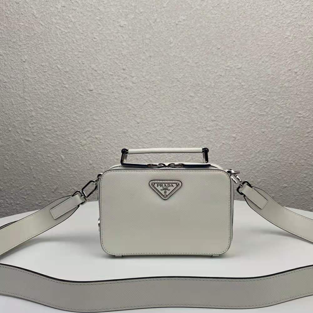 Close-up of silver hardware on Prada Men Prada Brique Saffiano Leather Cross-Body Bag-White