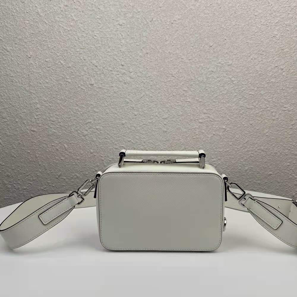 Side profile showing adjustable strap on Prada Men Prada Brique Saffiano Leather Cross-Body Bag-White