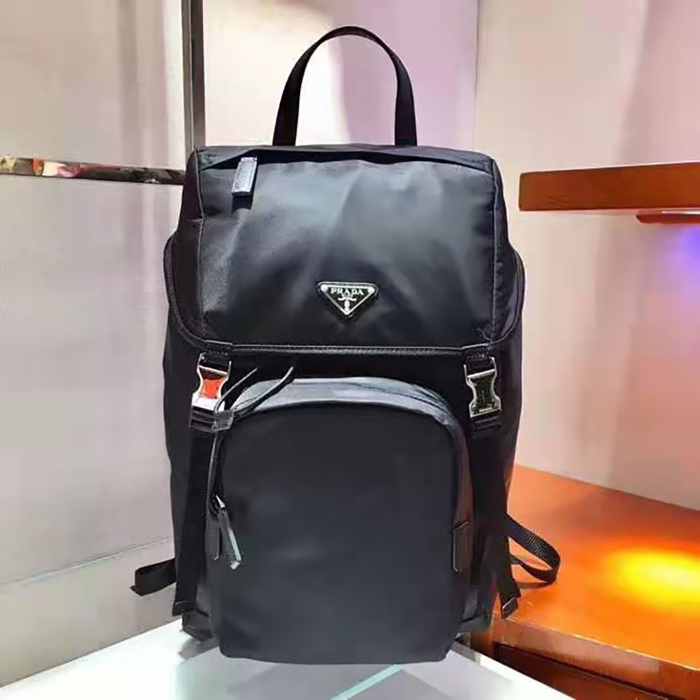 Close-up of leather trim and silver hardware on Prada backpack