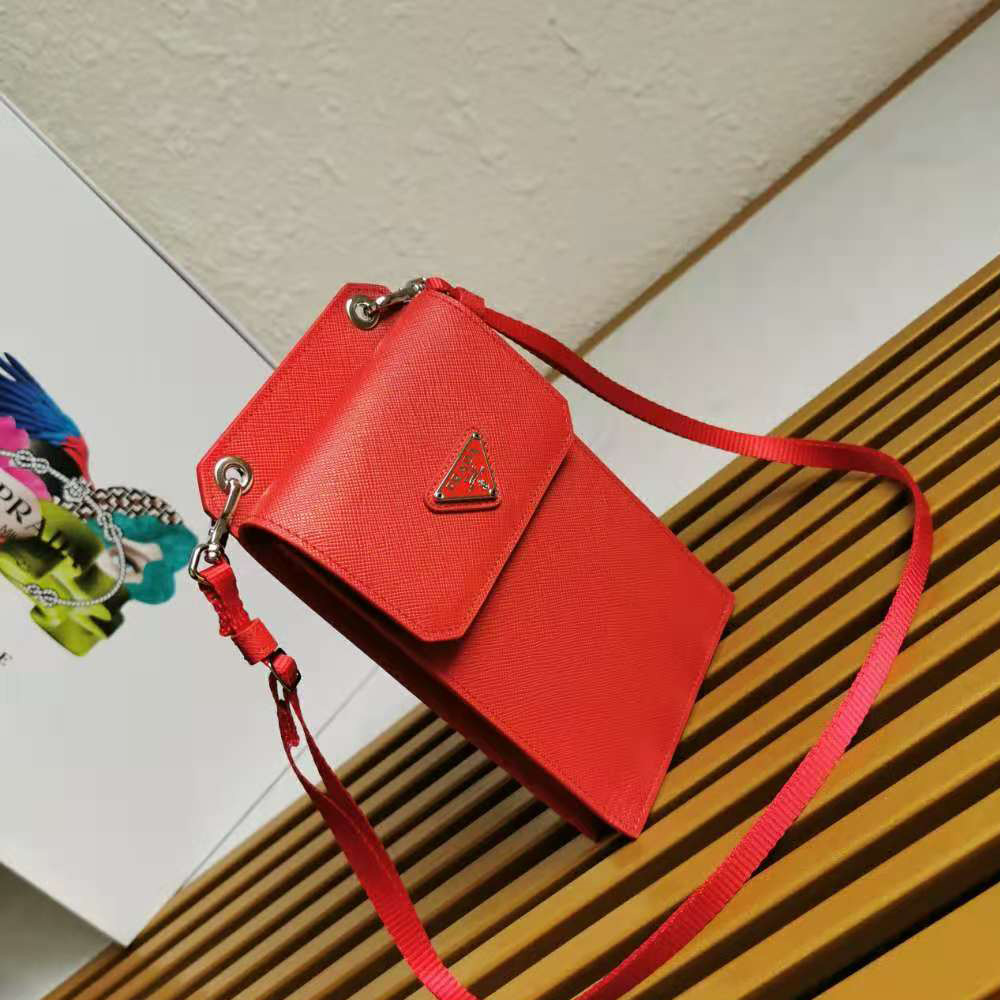 Side angle of Prada Men Saffiano Leather Smartphone Case-Red with flap closure visible