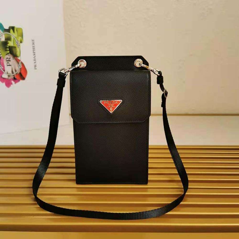 Close-up of Prada embossed logo on red saffiano leather smartphone case