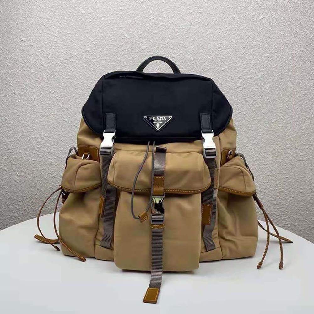 Close-up on polished silver hardware of Prada Men Technical Fabric Nylon Backpack-Brown
