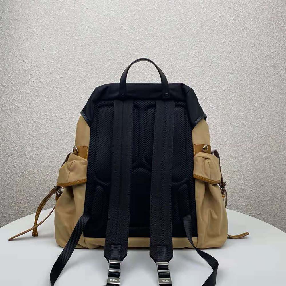 Side profile of Prada Men Technical Fabric Nylon Backpack-Brown highlighting sleek silhouette