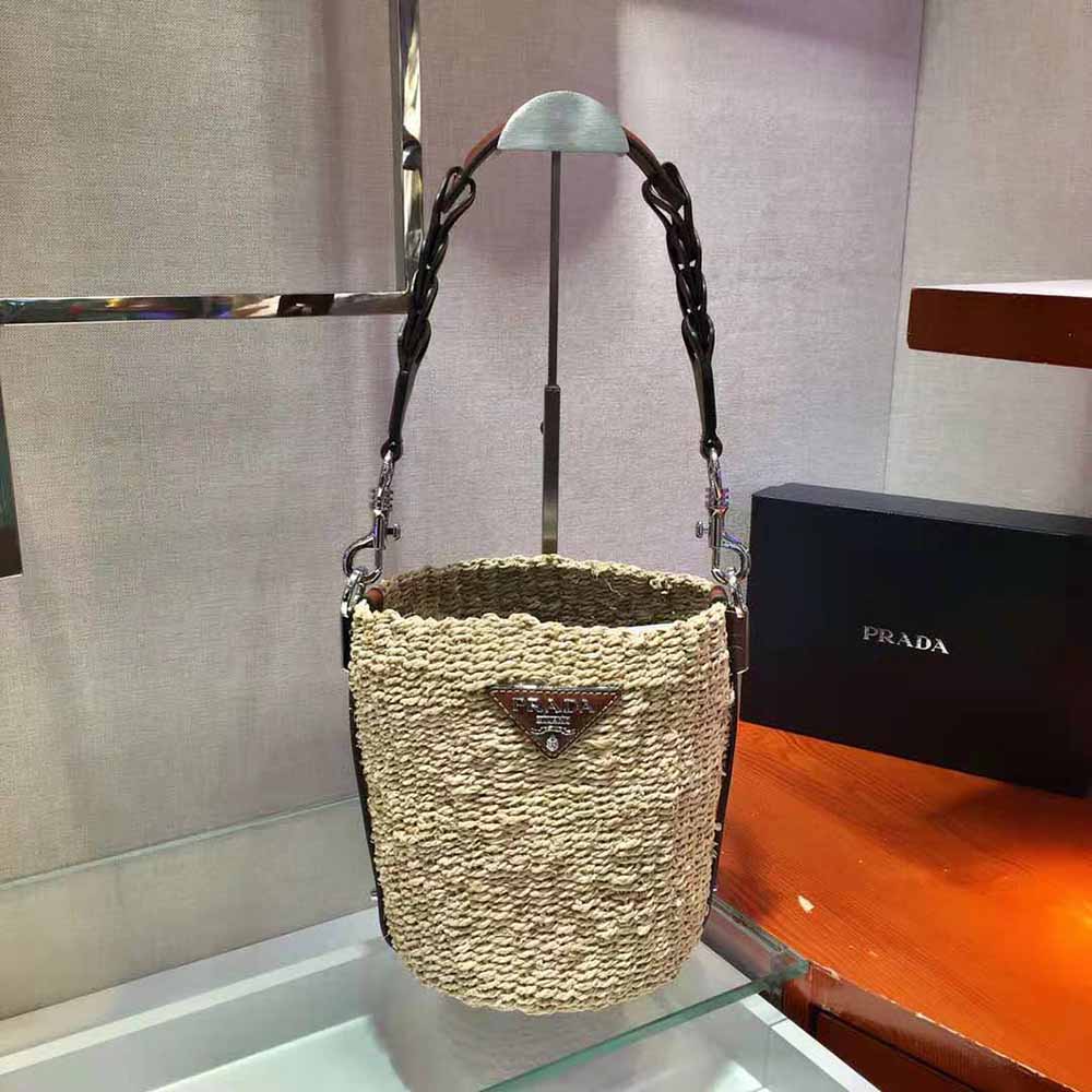 Side angle of Prada Women Corn Husk and Leather Bucket Bag with silver hardware