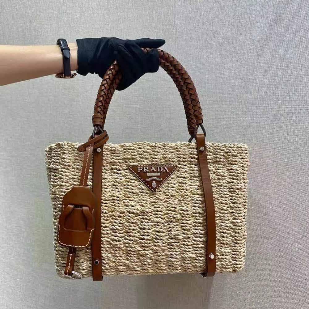 Close-up of corn husk texture and gold hardware on Prada Tote