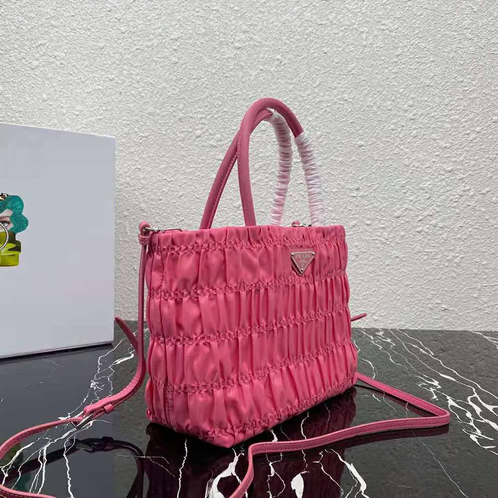 Side angle highlighting zip closure and strap on Prada Women Embossed Nylon Tote-Pink