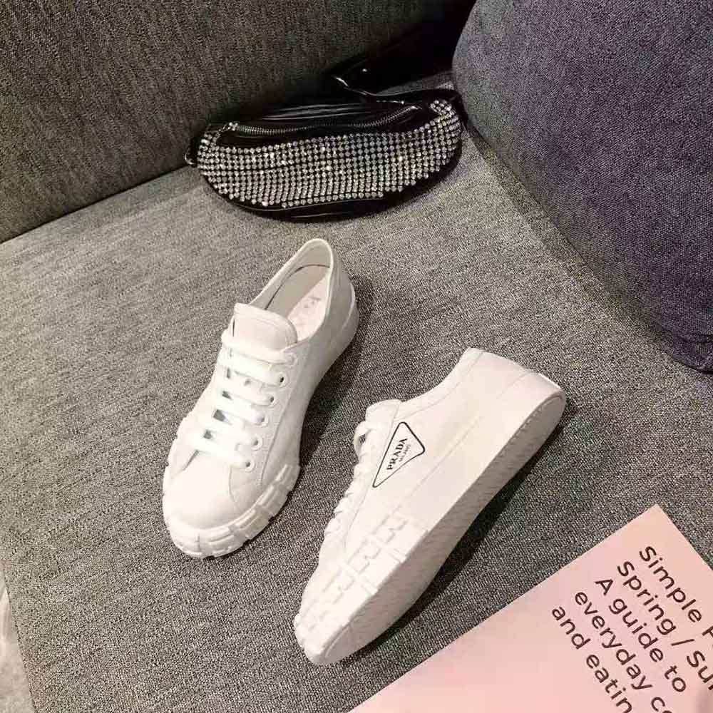 Top-down angle of Prada Women Gabardine Fabric Sneakers-White with lace closure