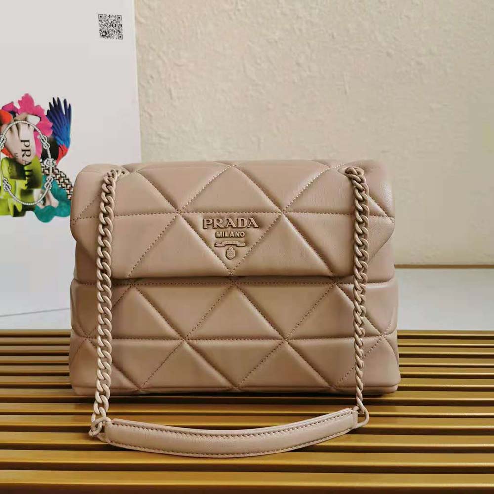 Close-up of Prada Spectrum silver-tone hardware on pink leather bag