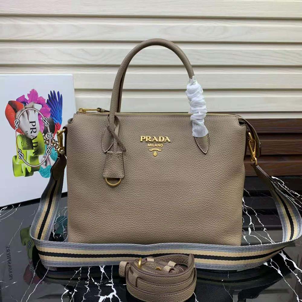 Close-up of metal logo lettering on Prada Women Leather Handbag beige