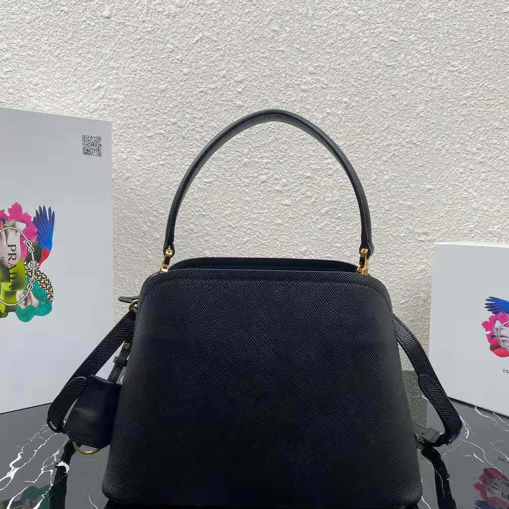 Side angle showing structured silhouette of Prada Women Medium Saffiano Leather Prada Matinee Bag-Black