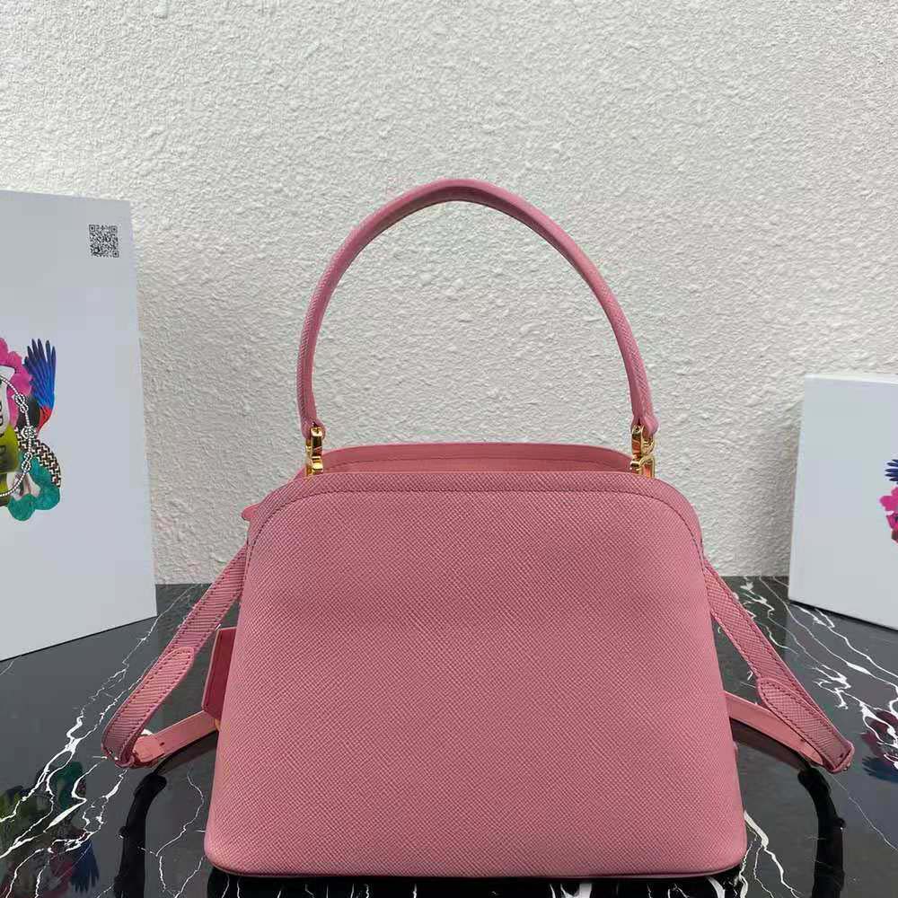 Side angle showing structured silhouette of Prada Women Medium Saffiano Leather Prada Matinee Bag-Pink