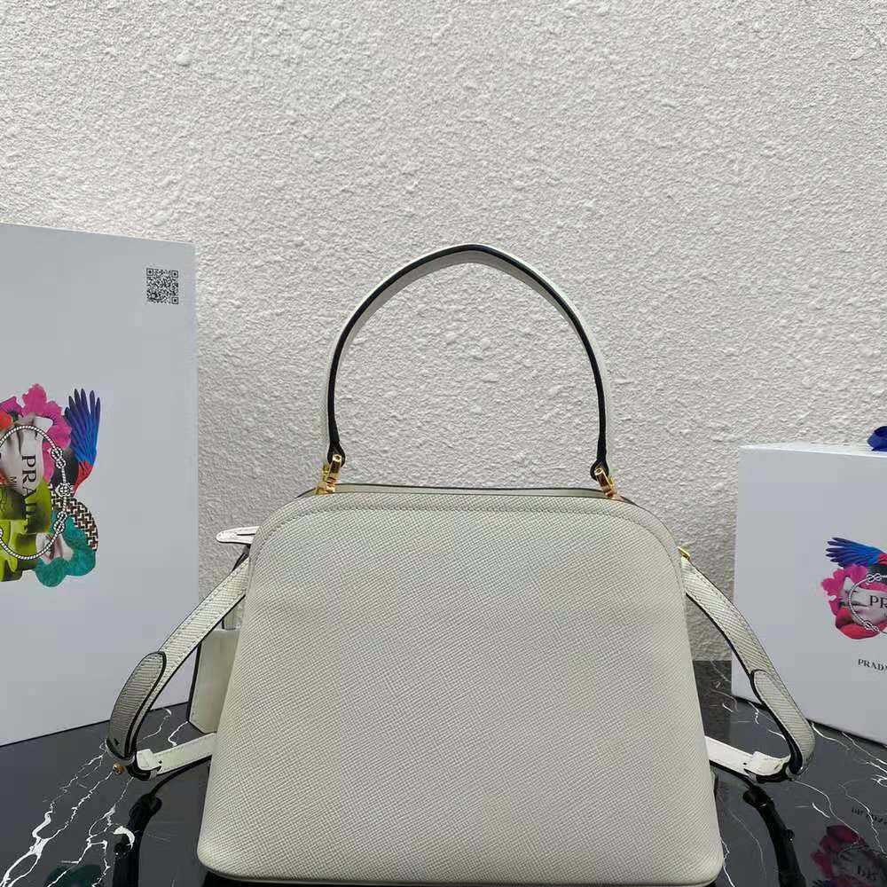 Side profile showcasing texture of Prada Women Medium Saffiano Leather Prada Matinee Bag-White