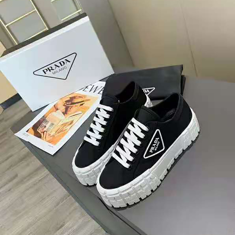 Close-up on lace-up closure and Prada logo of Nylon Gabardine Sneakers