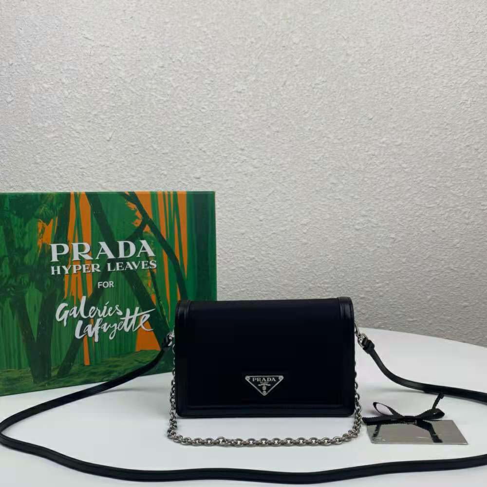 Close-up of silver hardware and leather trim on Prada Women Nylon Mini-Bag-Black