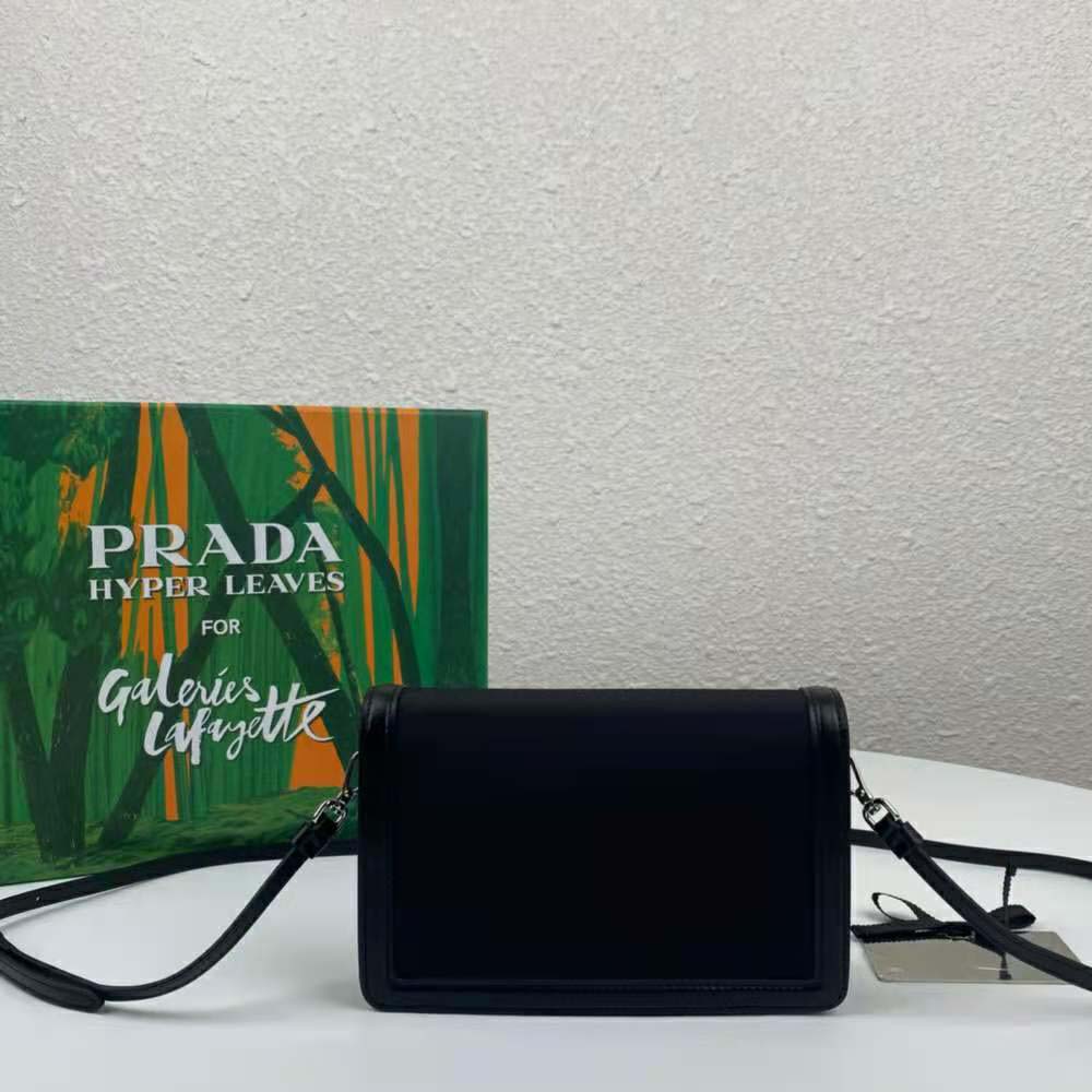 Side profile showing adjustable strap of Prada Women Nylon and Leather Mini-Bag-Black